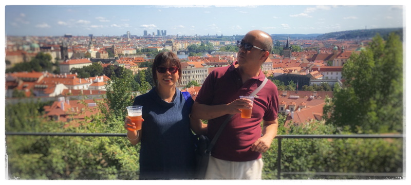 Gordon and Angela posing above views of Charles Bridge