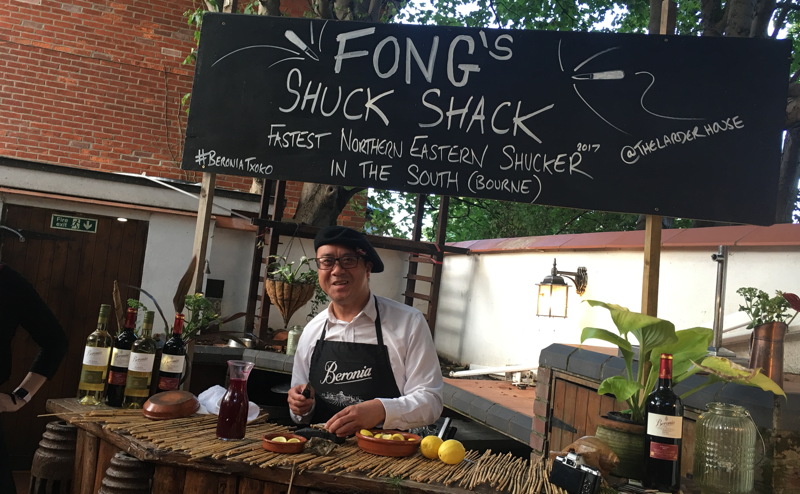 Gordon Fong standing at his Oyster Chucking stand