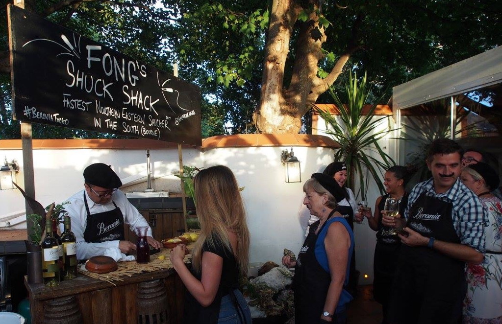 A queue of people waiting for their oysters to be opened.